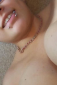 sensuous plus-size damsel seductively undressing in bedroom