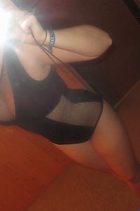 two voluptuous plus-size damsels in personal embrace, kissing passionately